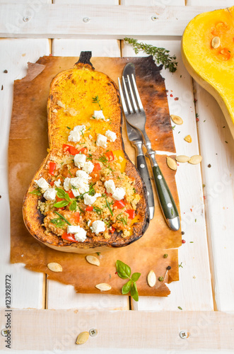Pumpkin stuffed with couscous, zucchini and cheese