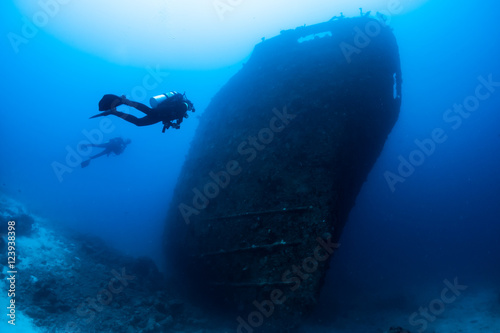 Divers exploring shipwreck