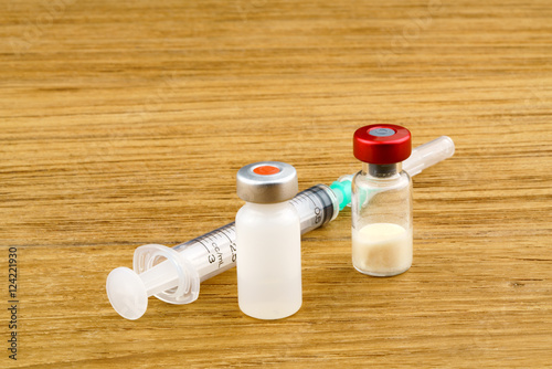 Vaccine and plastic medical syringe