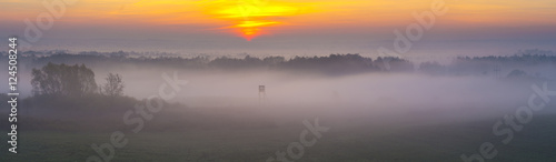 Hunting tower in the morning fog,panorama