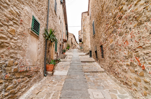 The narrow street in the historic center of Castiglione della Pescaia, Tuscany, Italy 