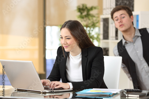 Businessman spying his colleague at job