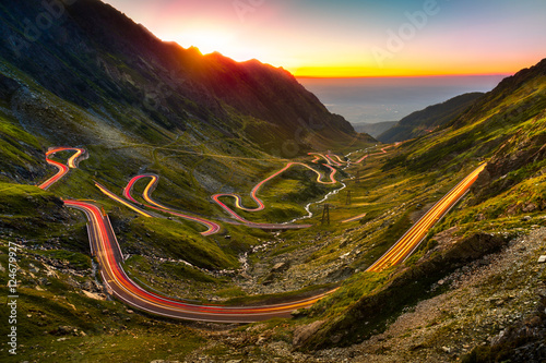 Traffic trails on Transfagarasan pass at sunset. Crossing Carpathian mountains in Romania, Transfagarasan is one of the most spectacular mountain roads in the world.