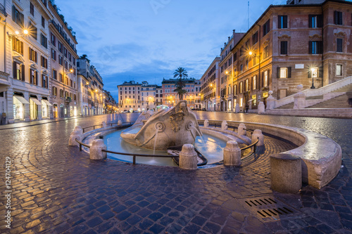 Barcaccia fountain in Piazza di Spagna by night, Rome, Italy