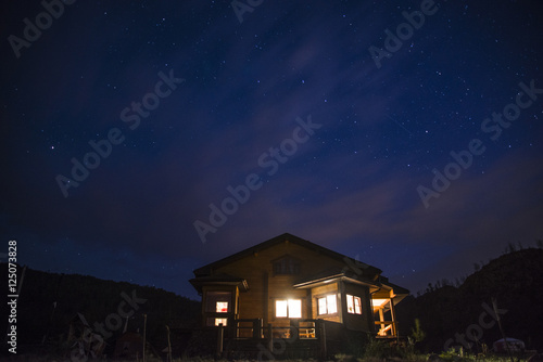 Wonderful starry sky above the farm house.