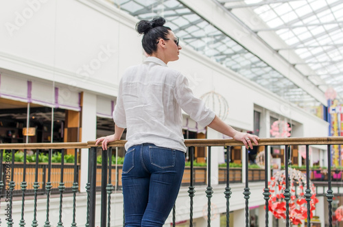 Young woman standing in the shopping mall