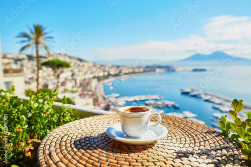 Cup of espresso coffee with view on Vesuvius mount in Naples