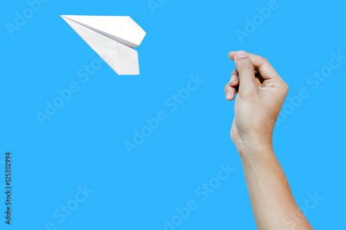 paper aero plane ready to take off as a conceptual picture on blue background