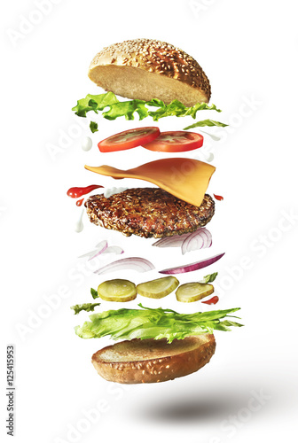 Delicious hamburger with flying ingredients
