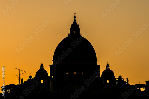 silhouetted vatican dome at sundown