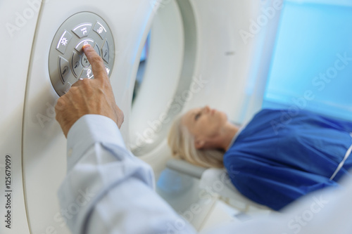 Radiologic technician and Patient being scanned and diagnosed on