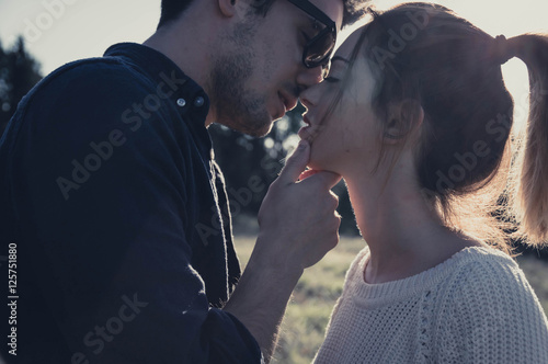 Loving couple kissing outdoor. 