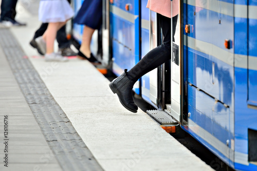 Woman entering tram