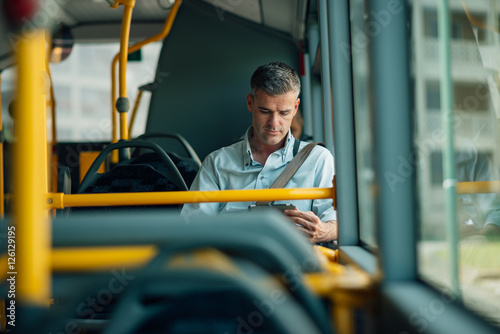 Businessman traveling by bus