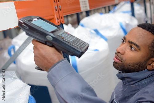 worker scanning the product