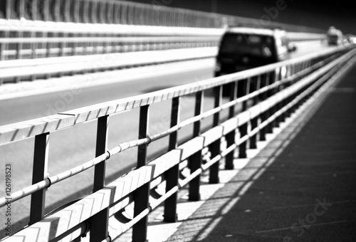 Black and white car on Norway bridge perspective background