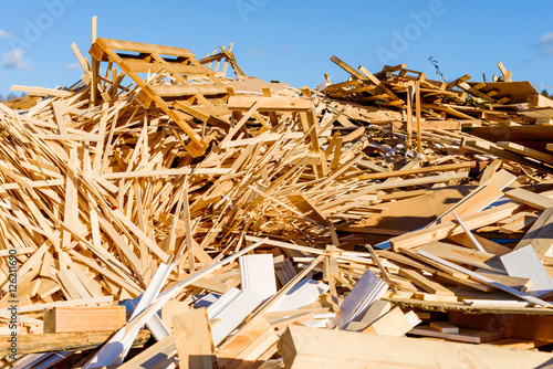 Pile of wooden debris in industrial area. The wood is later shredded to be used as fuel.