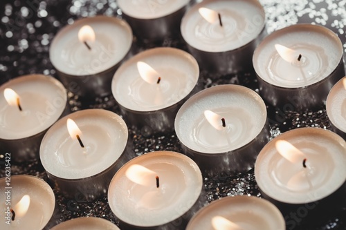 Close-up of candles burning