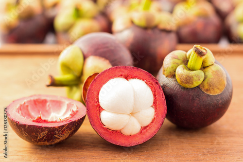 Purple mangosteen - Mangosteens queen of fruits with wooden back