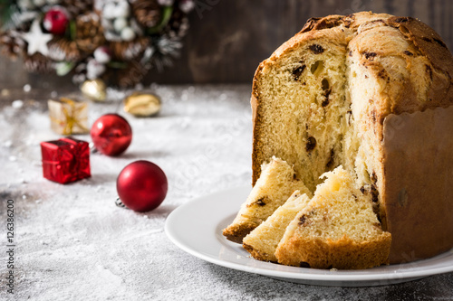 Christmas cake panettone and Christmas decoration on wooden background