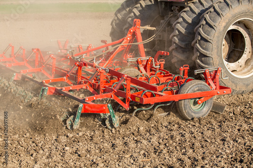 Close up shot of seedbed cultivator machine at work