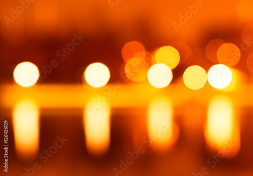 Night city lights bokeh with reflections background