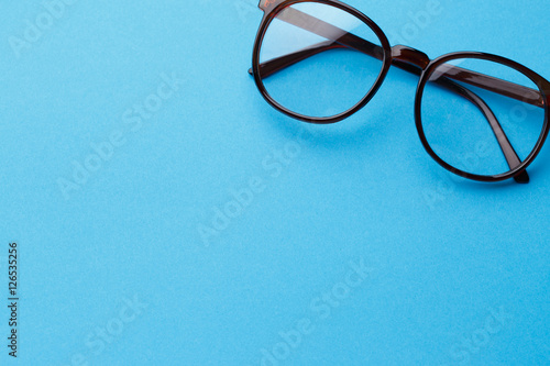 Brown-rim eyeglasses in empty background