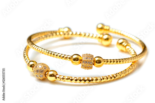 Golden bracelets , isolated on white background