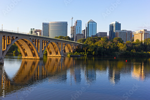 Key Bridge and Rosslyn skyline in early morning, Washington DC, USA. A view n Potomac River from Georgetown Park in US capital.