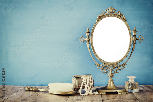 Old vintage oval mirror and woman toilet fashion objects