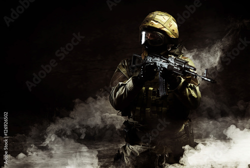 The man in the image of a member of the special forces with weap