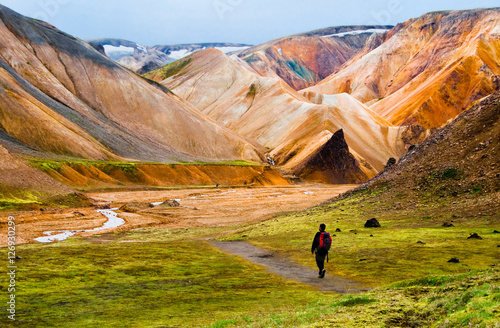 Hiker walking to Landmannalaugar mountains, Iceland