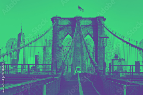 Brooklyn Bridge with flag on top. Duotone style.