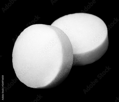 White naphthalene balls over dark background