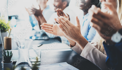 Close up view of business seminar listeners clapping hands. Professional education, work meeting, presentation or coaching concept.Horizontal,blurred background.