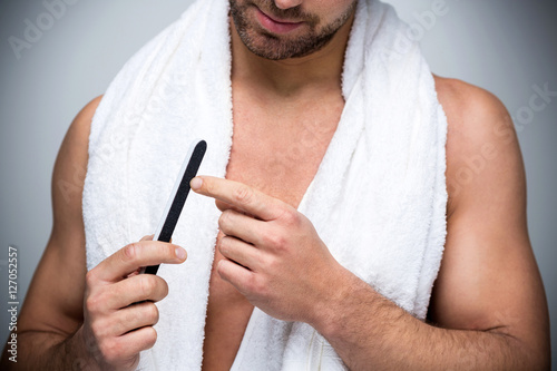 Man using a nail file 