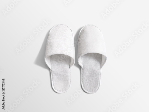 Pair of blank soft white home slippers, design mockup. House plain flops mock up template top view. Clear warm domestic sandal. Bed shoes accessory footwear.