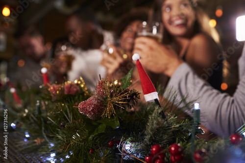 Christmas party at a bar, focus on foreground decorations