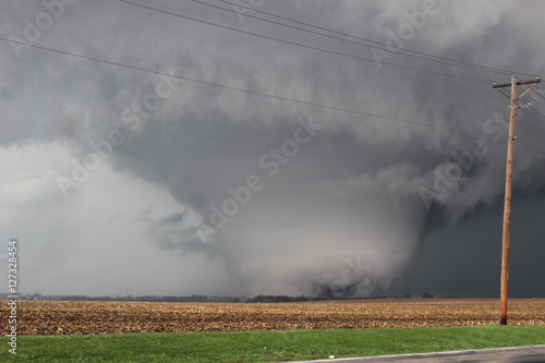 Massive wedge shaped tornado scours farmland in Illinois
