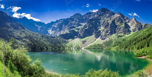 Stunning sunrise at lake in the Tatra Mountains in summer