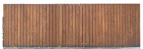 Solid wooden fence from brown vertical boards