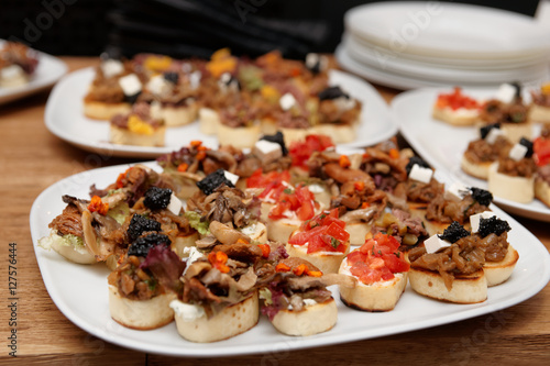 Bruschettas with meat and soft cheese