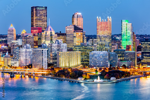 Pittsburgh downtown skyline at dusk. Located at the confluence of the Allegheny, Monongahela and Ohio rivers, Pittsburgh is also known as "Steel City", for its more than 300 steel-related businesses