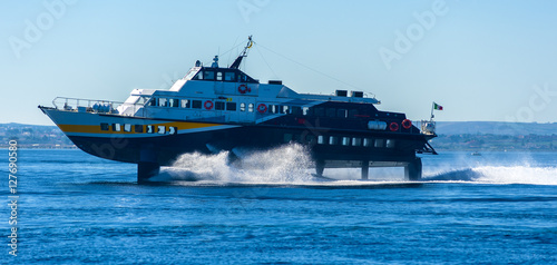 hydrofoil boat runs at full speed on the sea waves