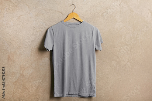 Blank grey t-shirt on grunge background