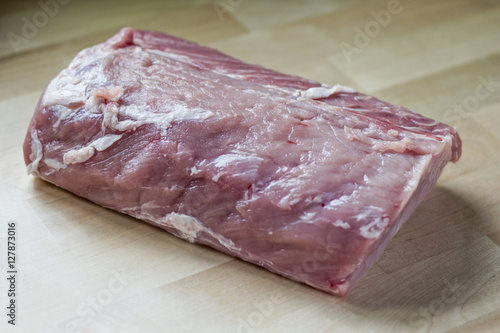 piece of raw pork meat on the table