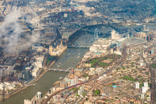 London, England from above with the Thames, Houses of Parliament, London Eye, Waterloo and Charing Cross stations.