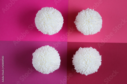 white pompons on pink mix geometric background 2