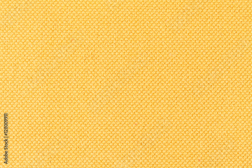 Background of yellow fabric, texture of the material, close up