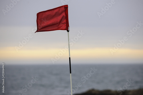 Waving red golf flag